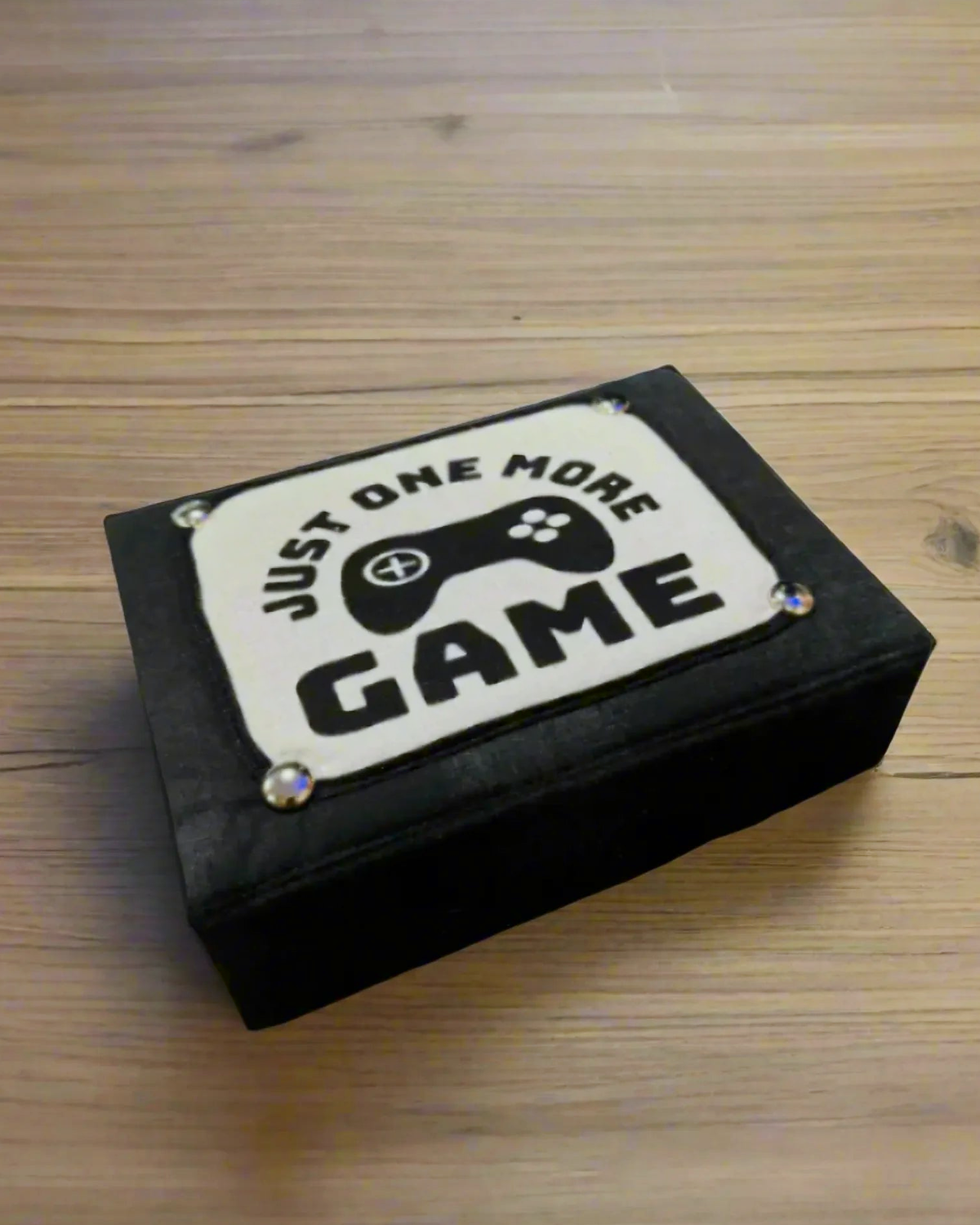 Black FlexBox One More Game fabric storage box with silver hardware and game-controller panel