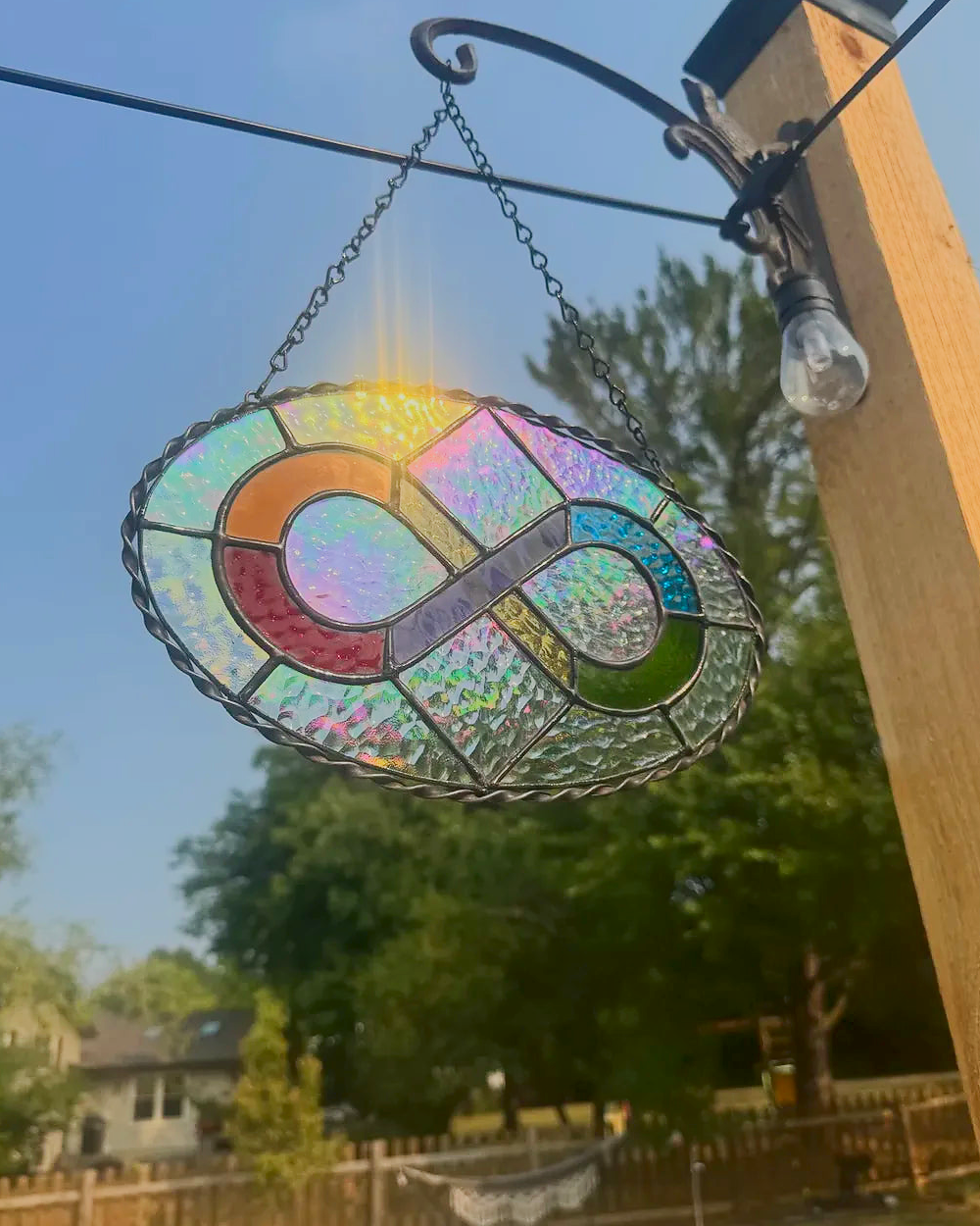 Rainbow infinity symbol stained-glass suncatcher with iridescent glass and twisted metal border