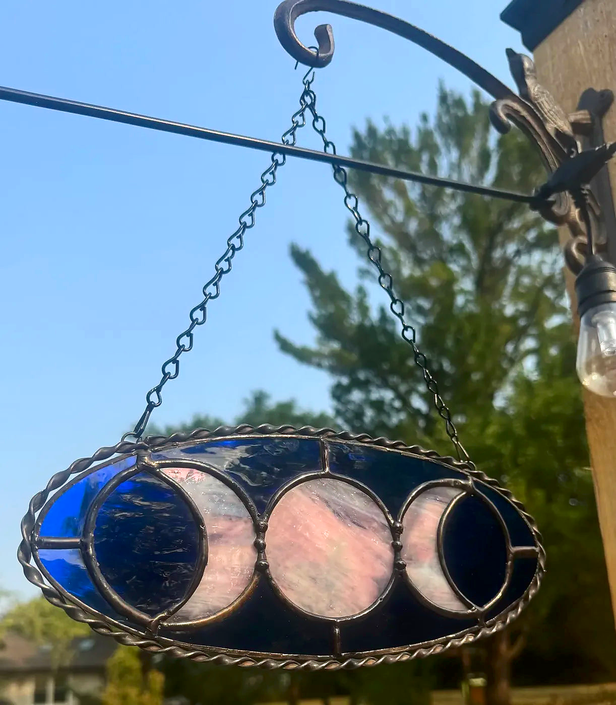 Close-up of the blue Triple Moon Goddess stained-glass suncatcher with extra solder detailing
