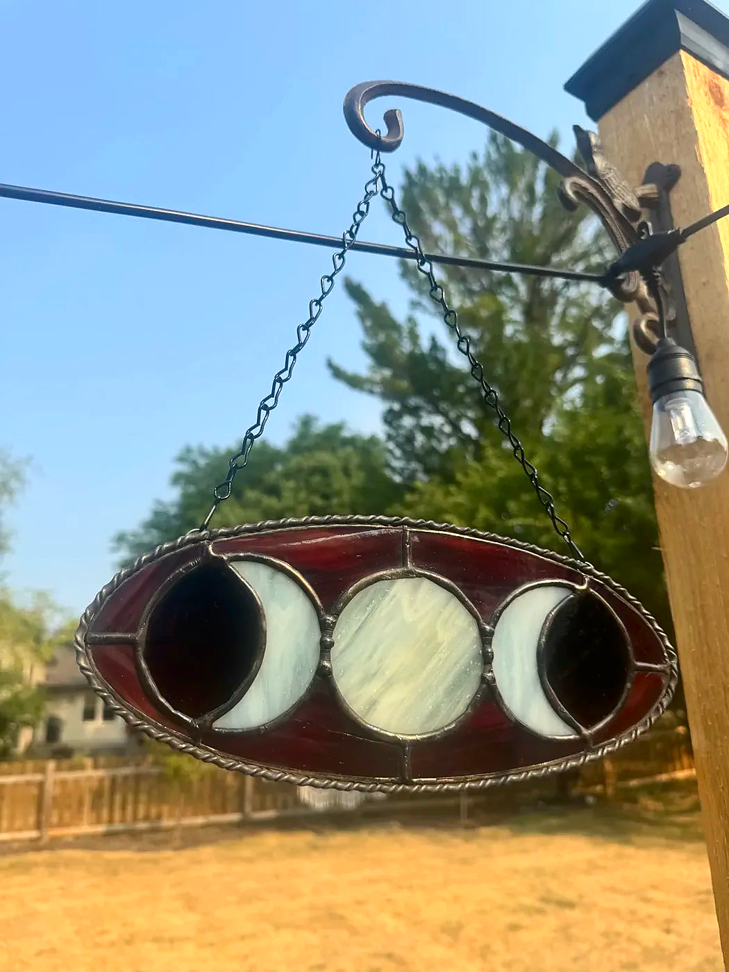 Close-up of the Deep Red Triple Moon Goddess stained-glass suncatcher with extra solder detailing