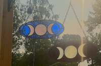 Triple Moon Goddess stained-glass suncatcher shown in blue and Deep Red colorways