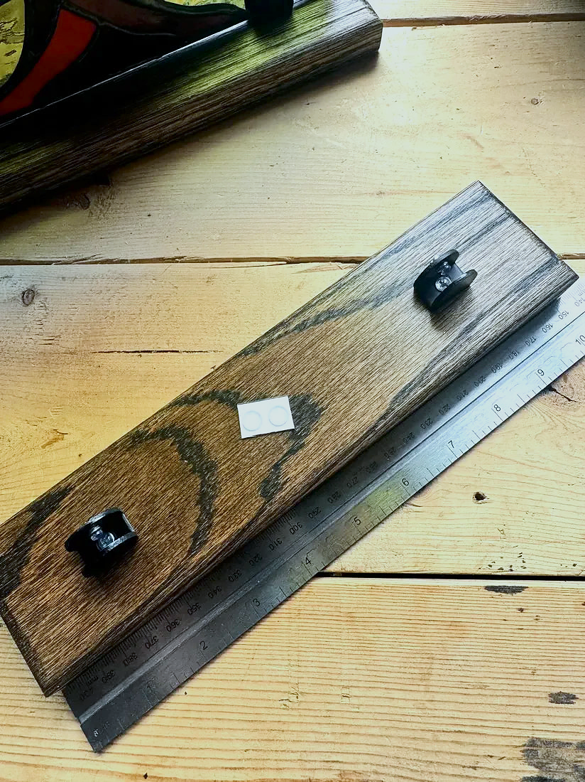 Front measurement view of a Jacobean-stained wood stand for stained glass