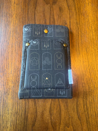 Small padded fabric device sleeve with Arched Mystic Symbols design, shown upright