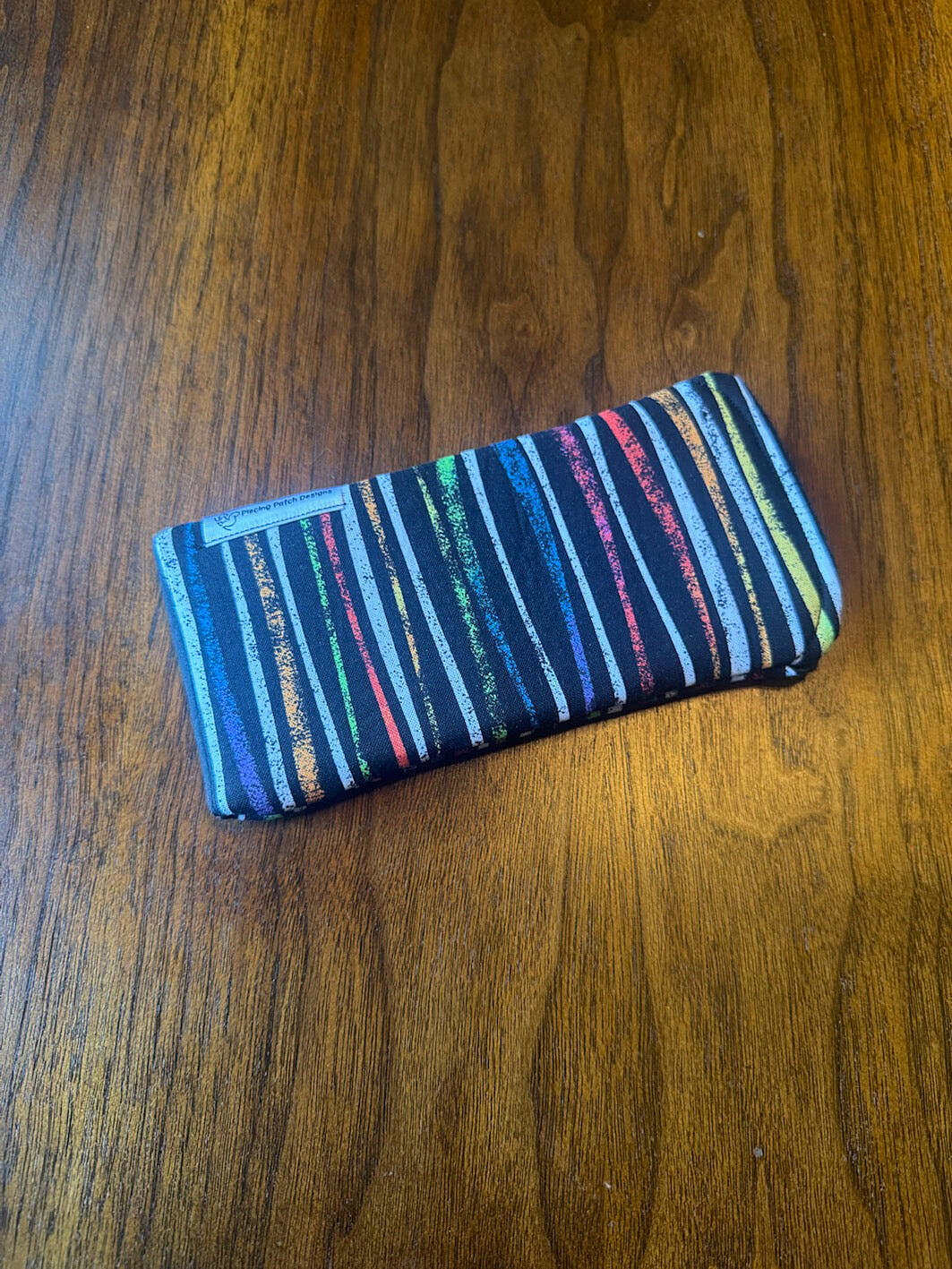 Padded fabric eyeglass case in Multi Streamers design, with built-in lens cloth