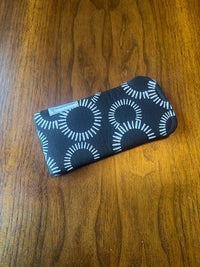 Padded fabric eyeglass case in Black and White Circles design, with built-in lens cloth