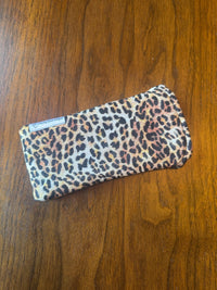 Padded fabric eyeglass case in Leopard animal print, shown with built-in lens cloth