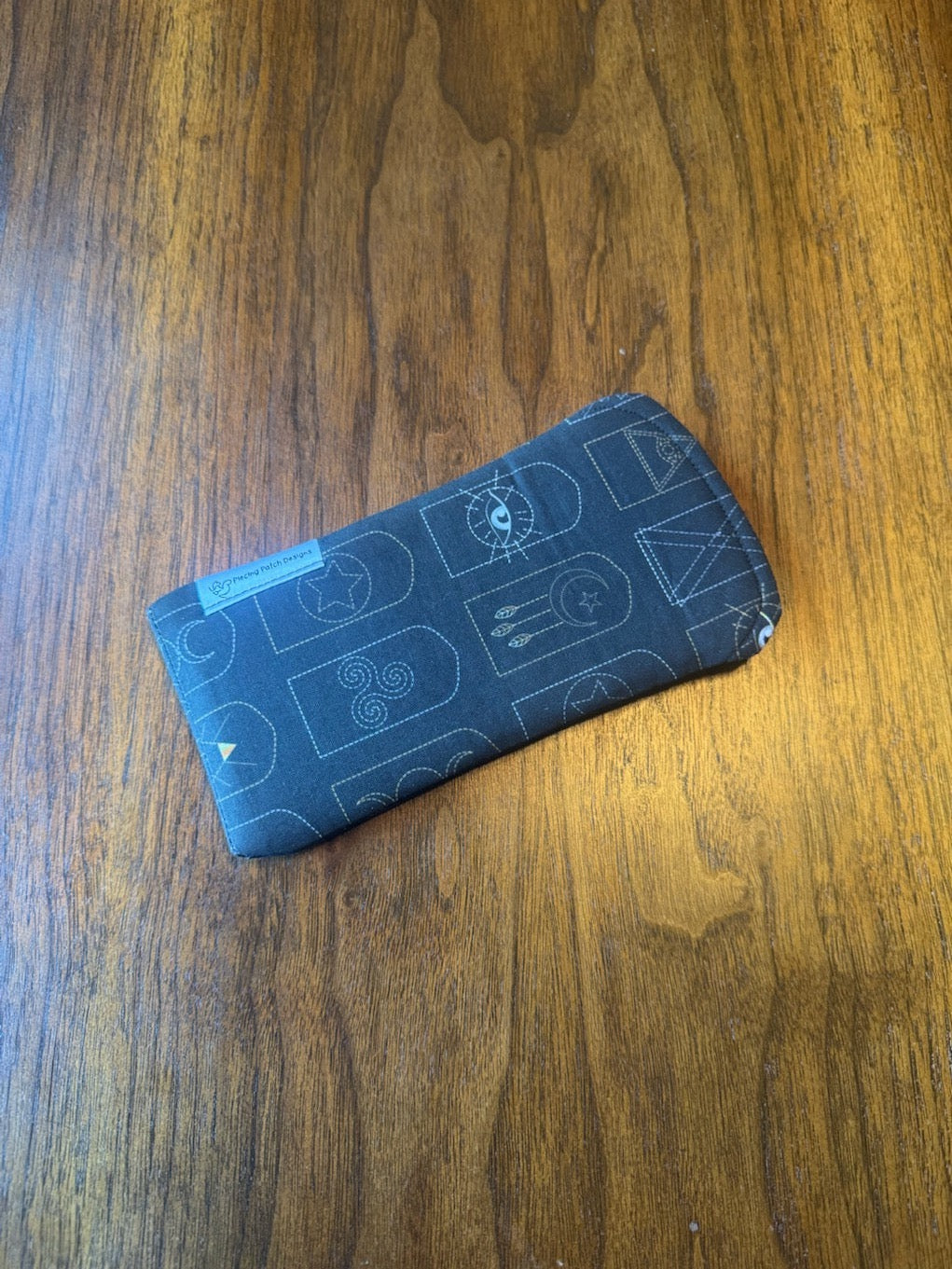 Padded fabric eyeglass case in Arched Mystic Symbols design, with built-in lens cloth