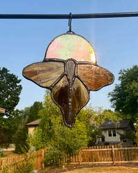 Amber luna moth stained-glass suncatcher with iridescent moon accent