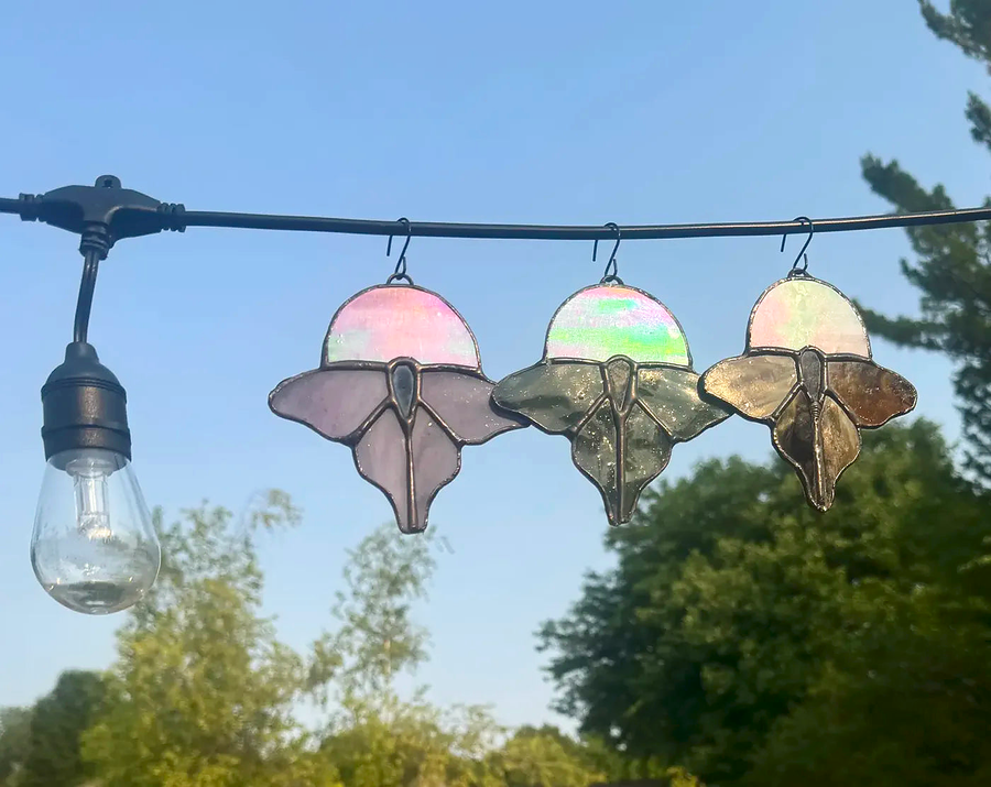 Luna moth stained-glass suncatcher shown with iridescent moon accent