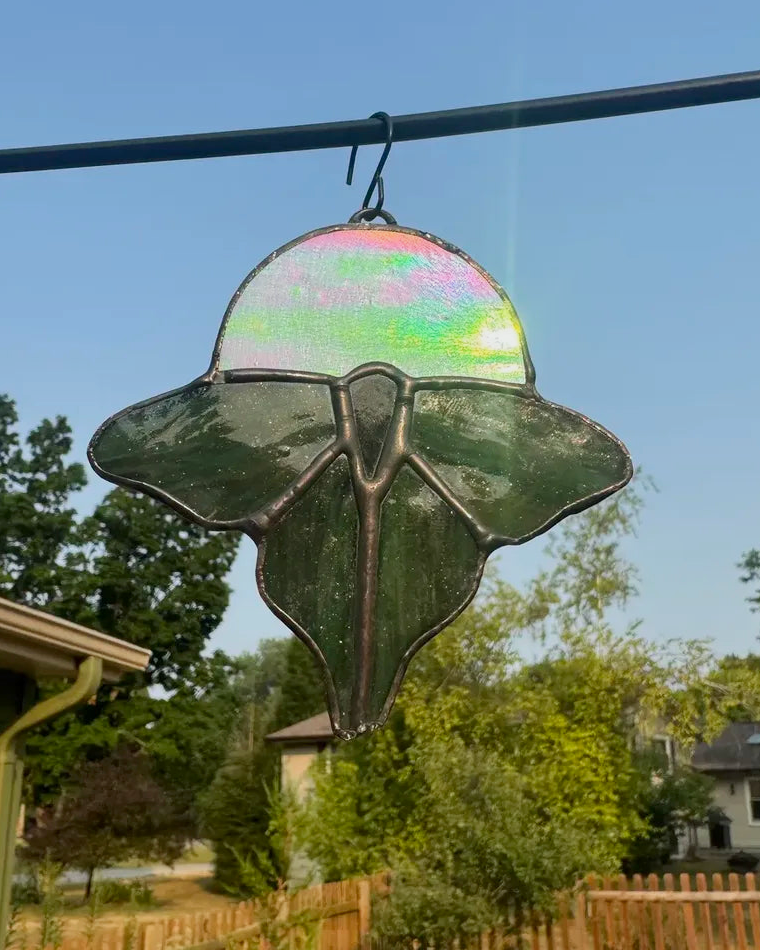 Green luna moth stained-glass suncatcher with iridescent moon accent