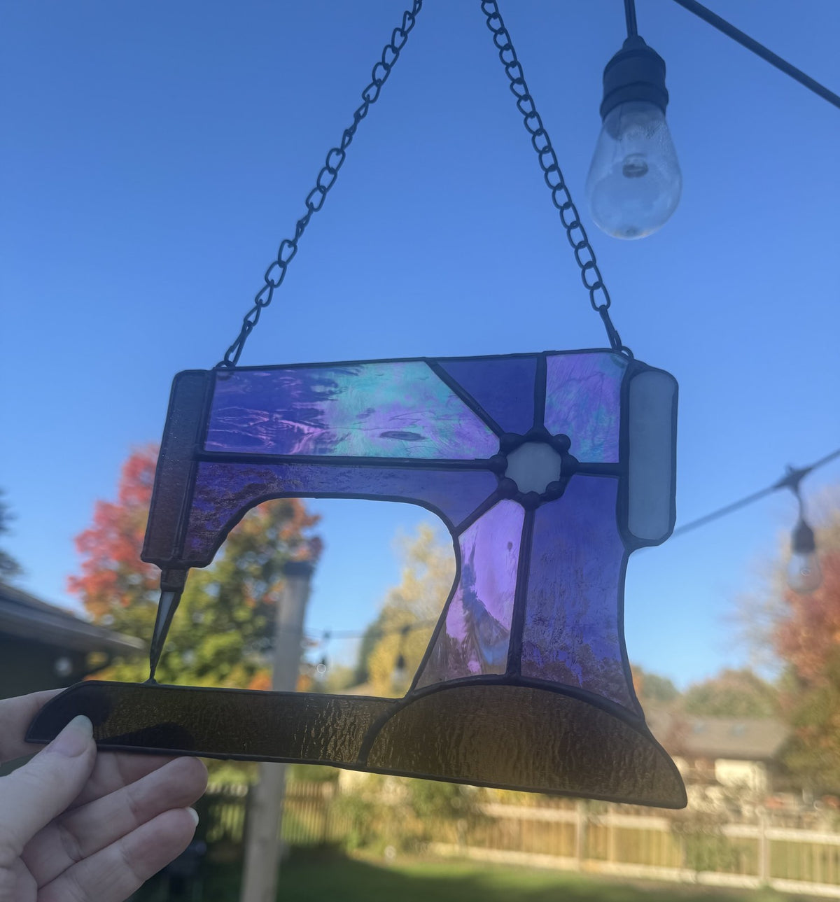 Sewing machine — Purple, in hand