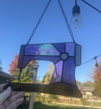 Sewing machine — Purple, in hand