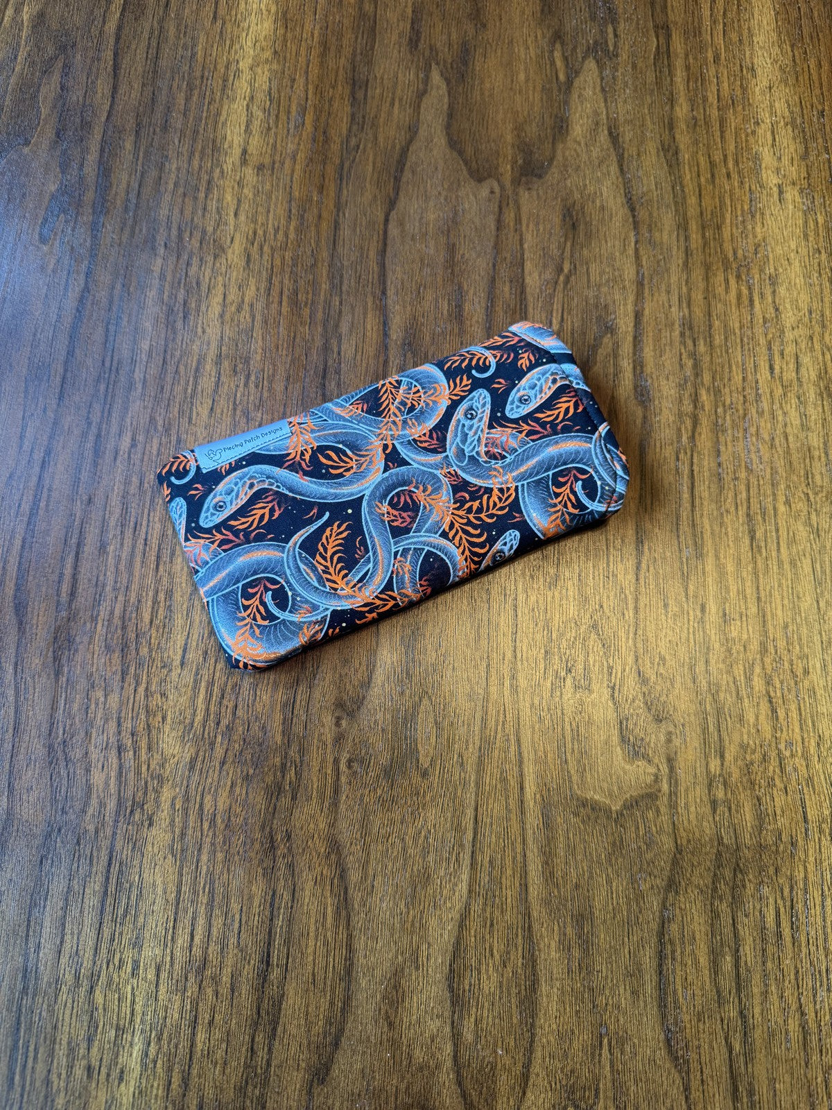 Padded fabric eyeglass case in Spirit Snakes design, with built-in lens cloth