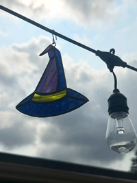 Close-up of the glass and solder details on the Witch's Hat stained-glass suncatcher